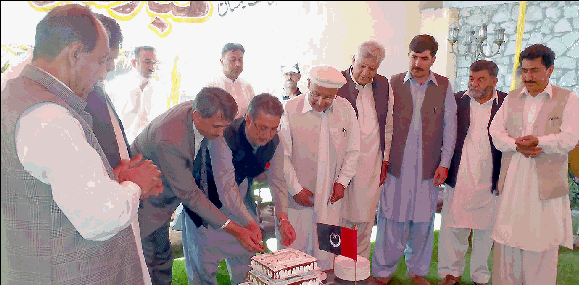 GB Chief Minister cutting a cake to celebrate the Imamat Day in memory of the day 55 years (11 July 1957) ago when His Highness 